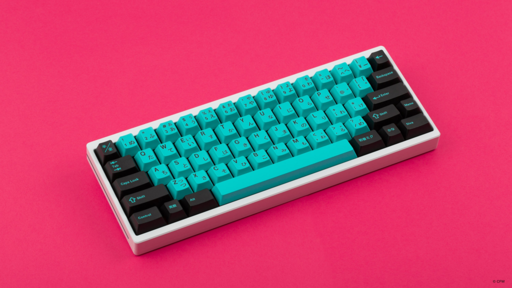 Hatsune Miku keycaps on 60% keyboard with pink background