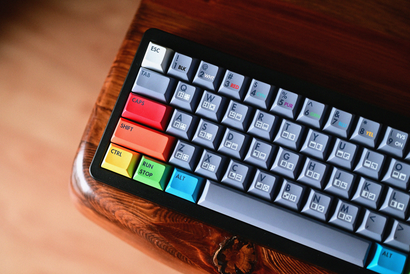 KAT Retrobytes Keycaps render showing colorful caps on board as it sits on wood table