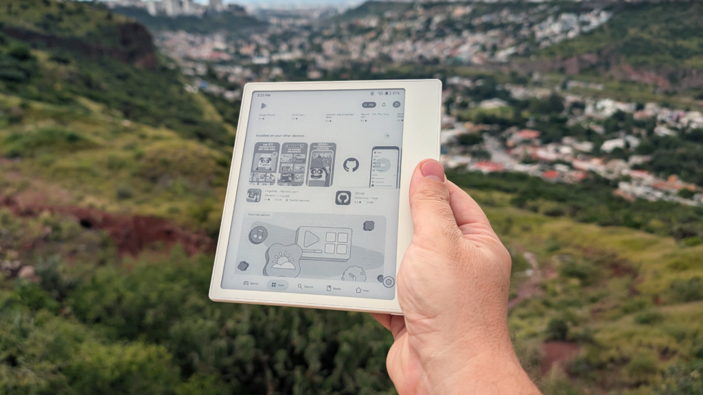 white boox go 7 in hand overlooking a valley