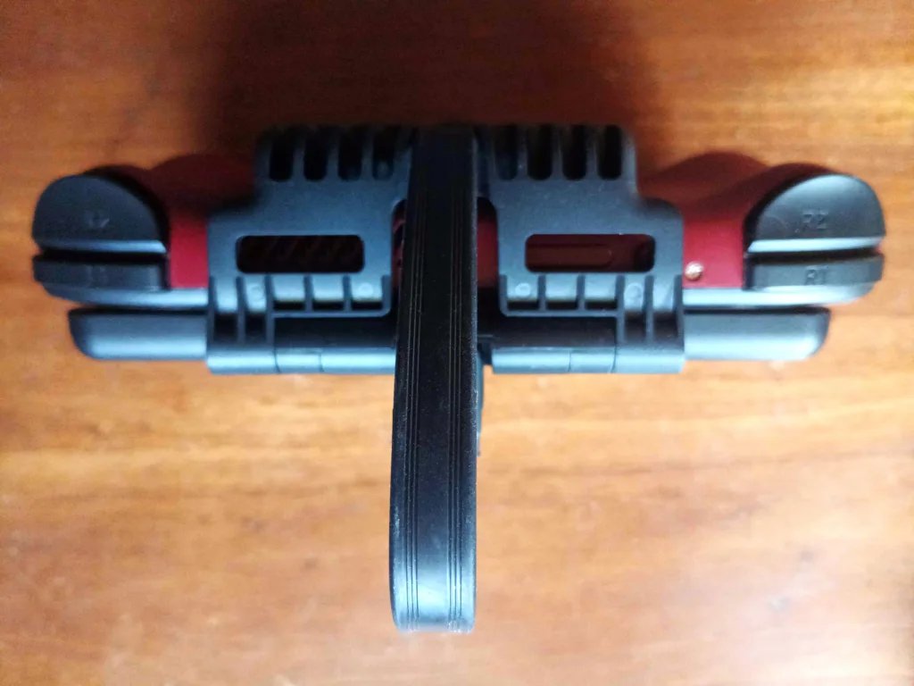 A top-down view of the Retroid Pocket Mini with the Dual-Screen attachment, showing how the attachment covers the volume and power buttons on the top of the device.