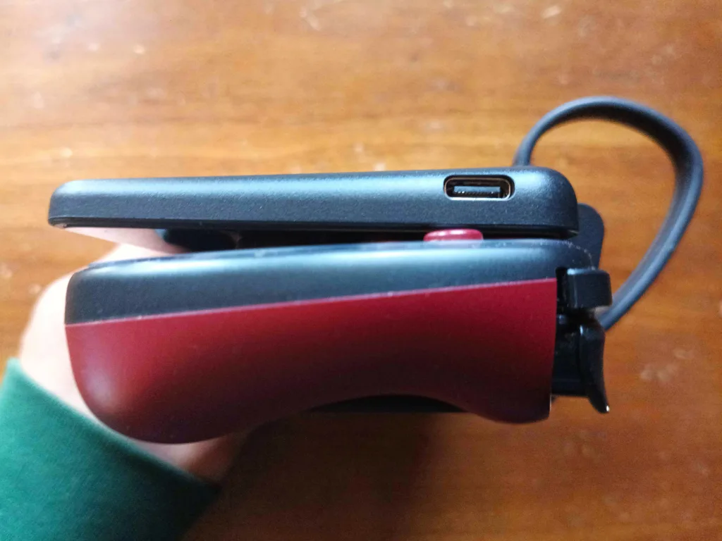 A picture of the Dual-Screen attachment from the side, showing how the joysticks prevent the lid from closing all the way.
