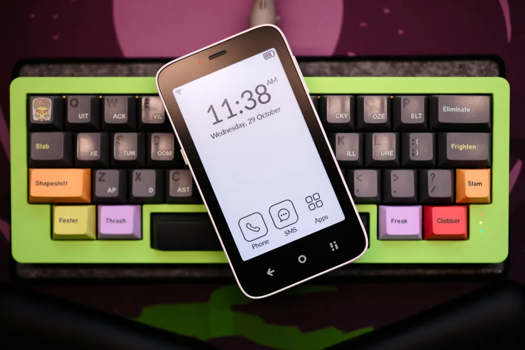 Mudita Kompakt laying on keyboard