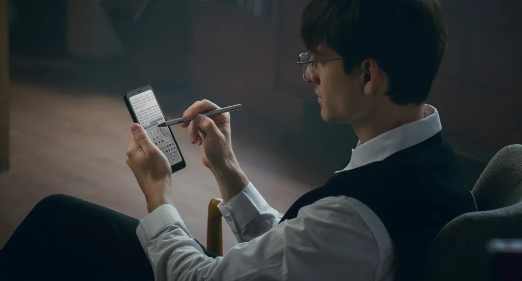 Boox Palma 2 Pro held ion hand with person writing