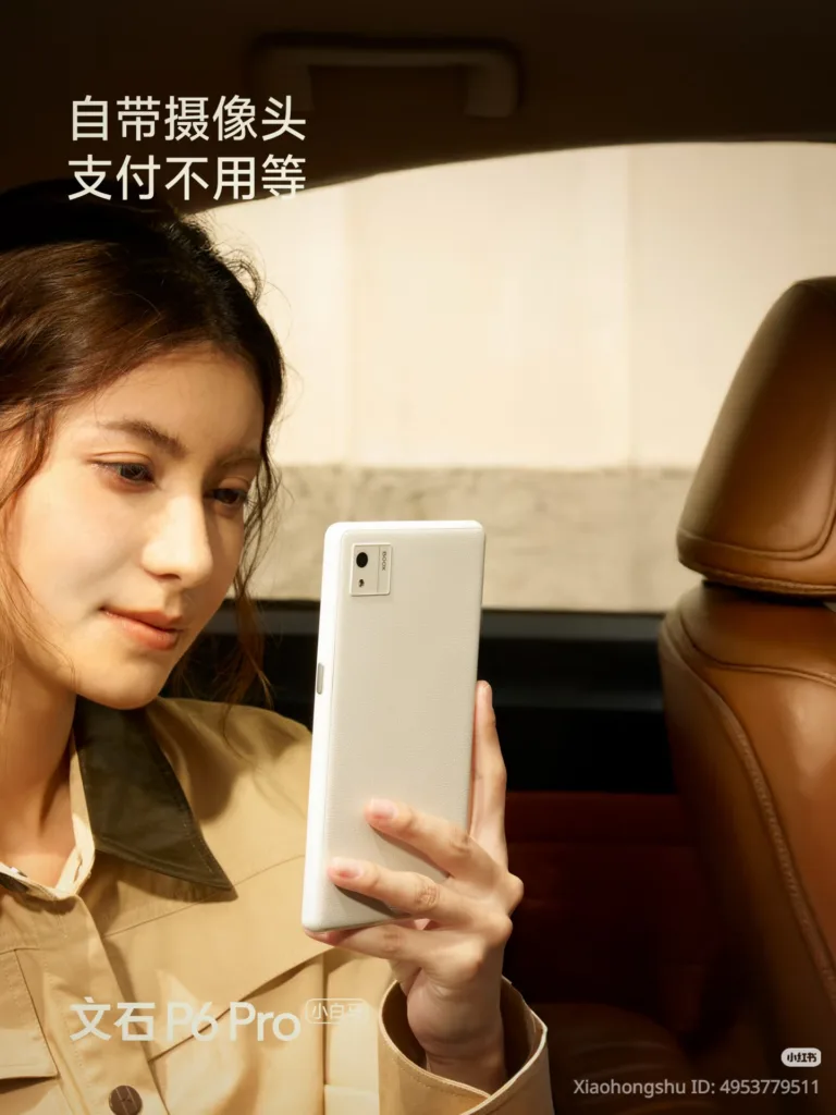 woman holding white boox p6 pro in the back of a car