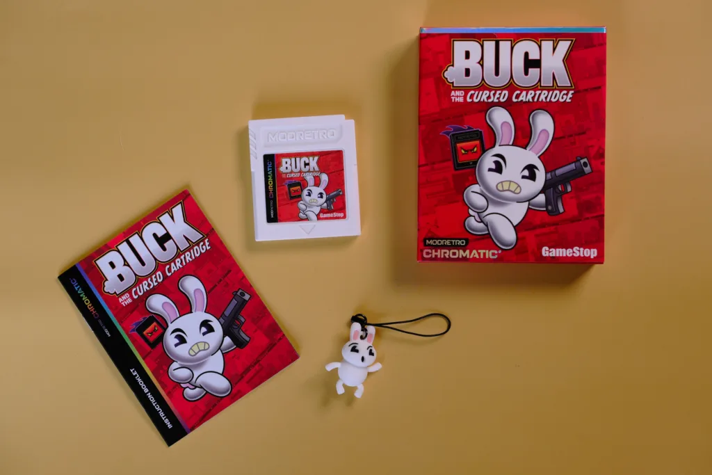 Buck and the Cursed Cartridge photo showing box, cart, charm, and instructions
