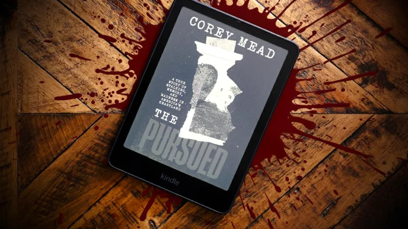 Kindle Paperwhite opn desk with Gemini blood splatter behind