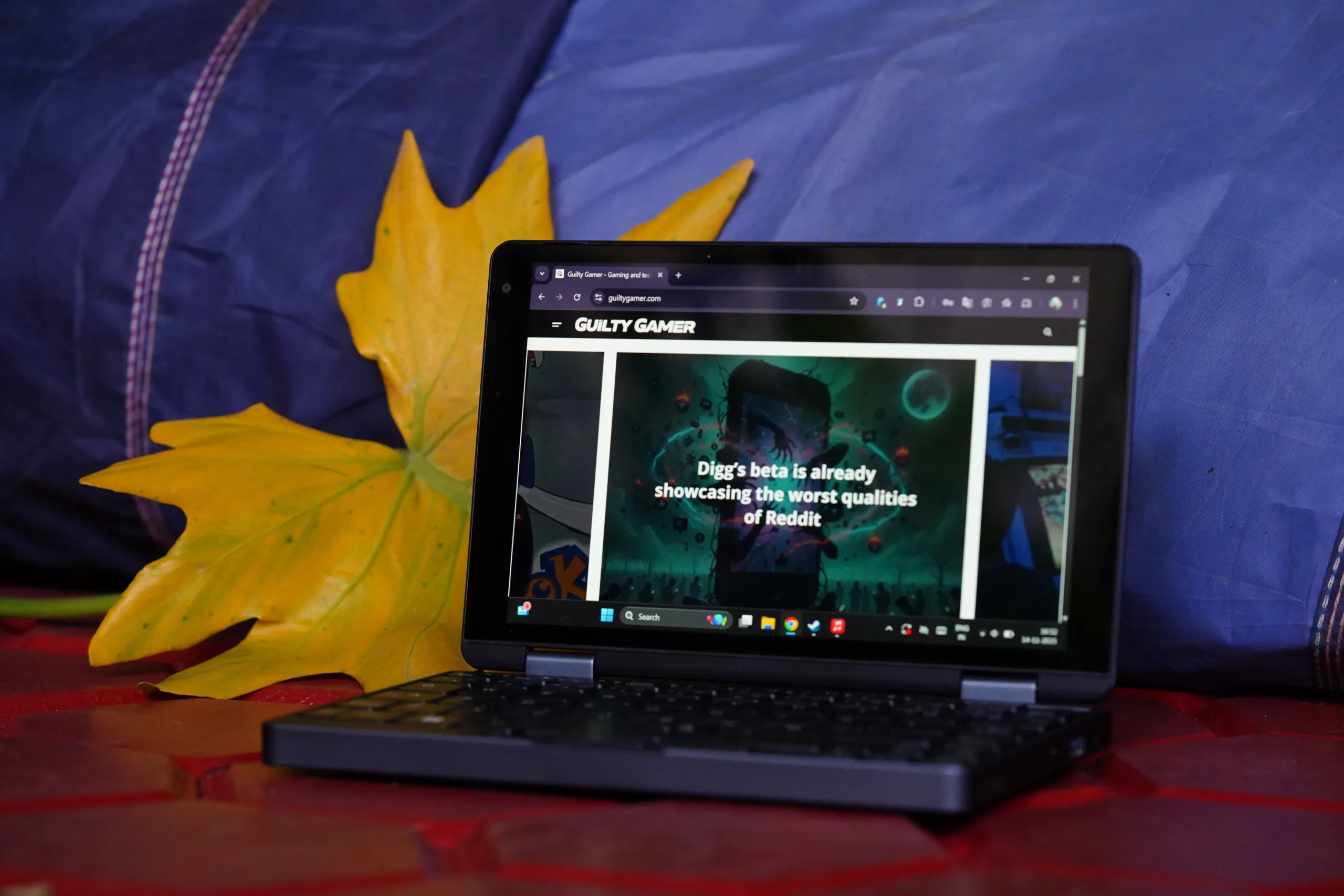 X-Plus Piccolo Netbook with lid open and colorful background