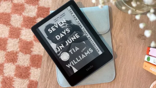 Kindle sitting on top of case on desk