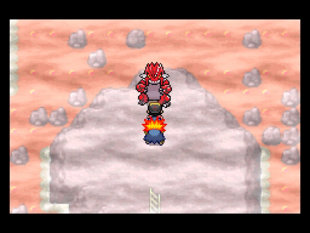 A picture of the player standing in front of Groudon in a volcano area.
