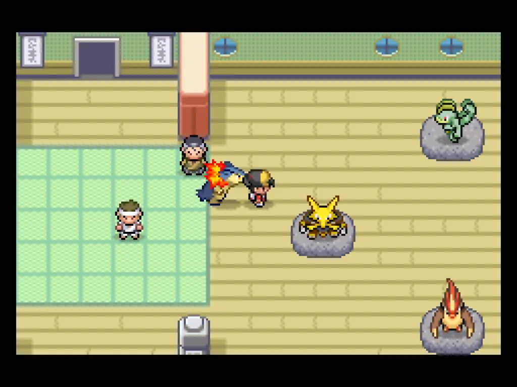 A picture of Saffron City's Fighting Dojo, showing Alakazam, Machamp, and Pidgeot available to fight for EV points.