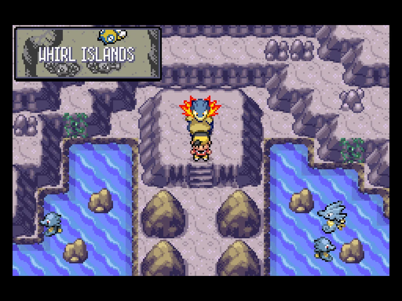 A picture of the player character and Typhlosion at the Whirl Islands, with a Horsea and Seadra in the water.