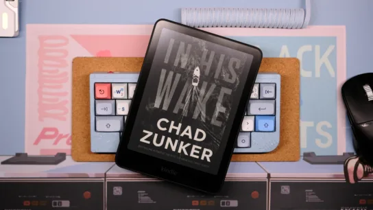 Kindle sitting on top of keyboard