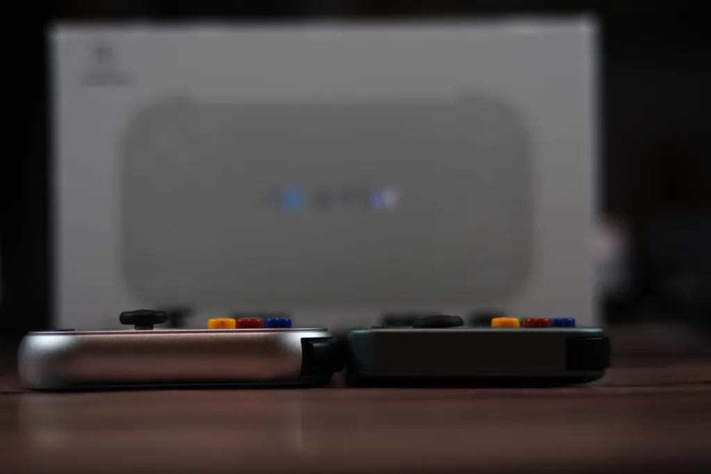 A picture of the RG 477m and RG 405m on a table, showing how much the joysticks stand out. The 477m's sticks are about twice as tall as the 405m's joysticks.