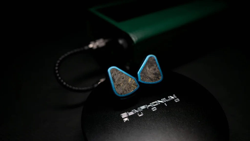 Symphonium Titan shells on top of its case, with the tube amp + DAP stack in the background