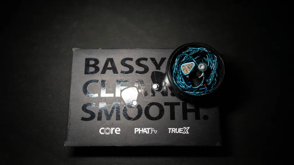 Symphonium Titan inside its case on top of its retail box