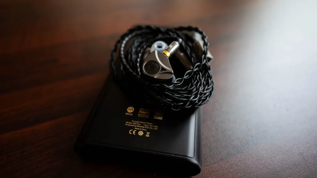 Elysian Apostle 2026 rolled on top of the Shanling M9 Plus DAP